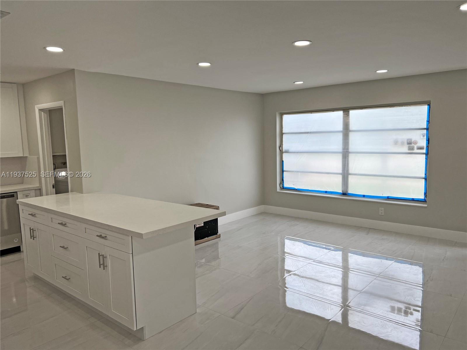 11962 Southwest 37th Terrace Miami, FL 33175 - Photo 5 of 24 a kitchen with a stove cabinets and wooden floor