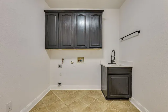 a view of storage and utility room with wooden floor