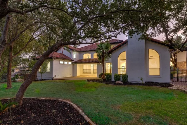a front view of a house with a yard