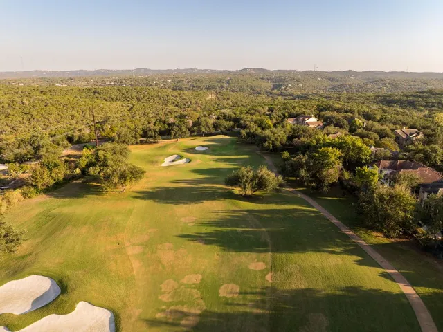 an aerial view of house with yard swimming pool and outdoor seating