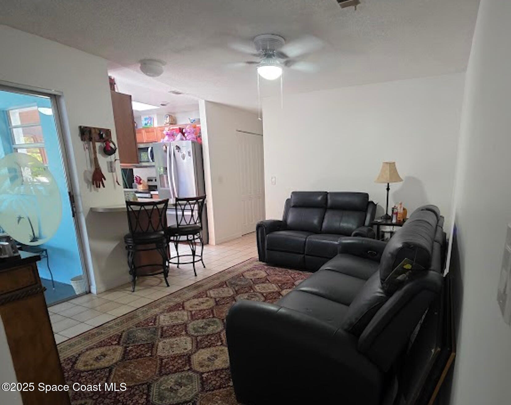 250 Perth Avenue Merritt Island, FL 32953 - Photo 12 of 48 a living room with furniture and wooden floor
