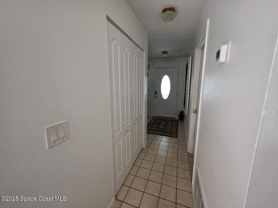 250 Perth Avenue Merritt Island, FL 32953 - Photo 16 of 48 a view of a bathroom from a hallway
