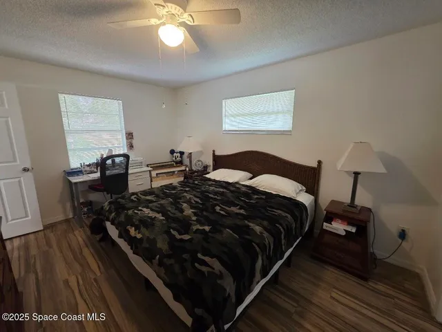 a bedroom with bed and window