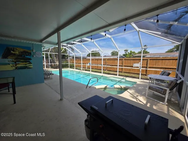 a view of a chairs and table in a patio