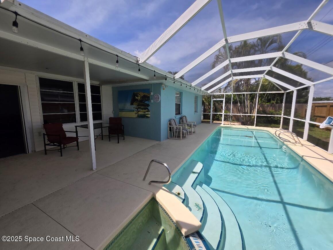 250 Perth Avenue Merritt Island, FL 32953 - Photo 38 of 48 a view of a chairs and table in a patio