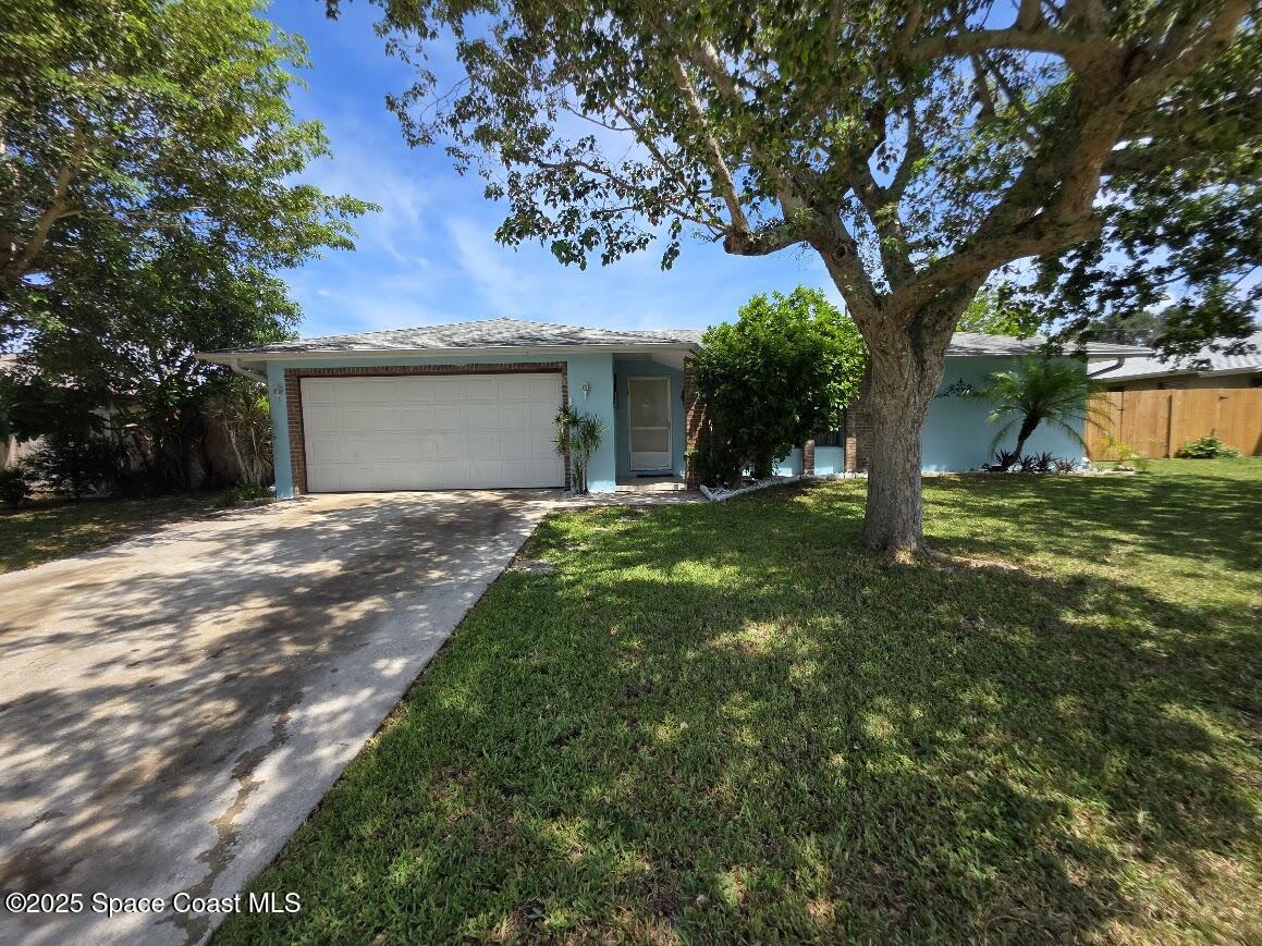 250 Perth Avenue Merritt Island, FL 32953 - Photo 4 of 48 a backyard of a house with lots of green space