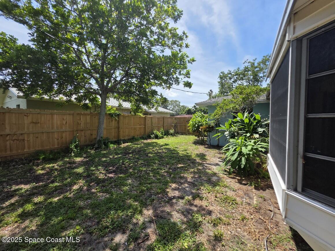 250 Perth Avenue Merritt Island, FL 32953 - Photo 41 of 48 a view of a backyard with large trees and plants