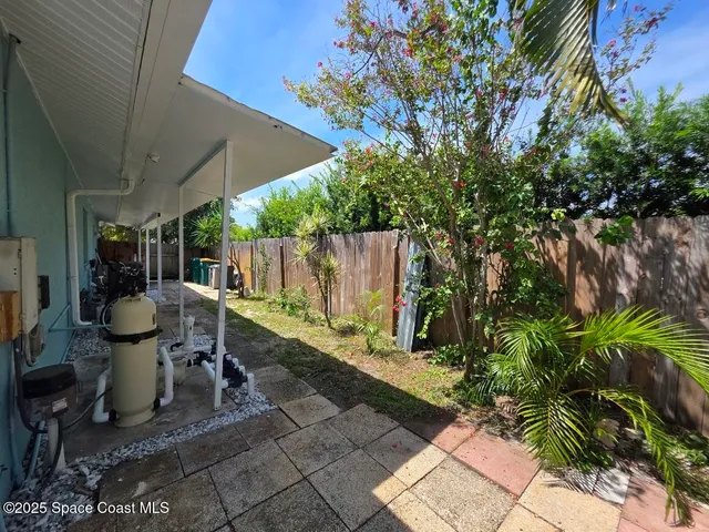 a view of a backyard with a tub