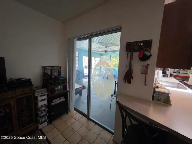 a room with a refrigerator and cabinets