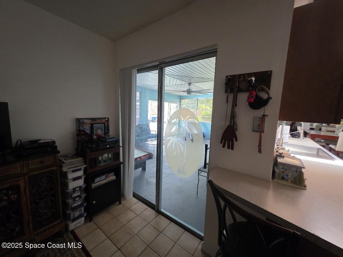 250 Perth Avenue Merritt Island, FL 32953 - Photo 9 of 48 a room with a refrigerator and cabinets