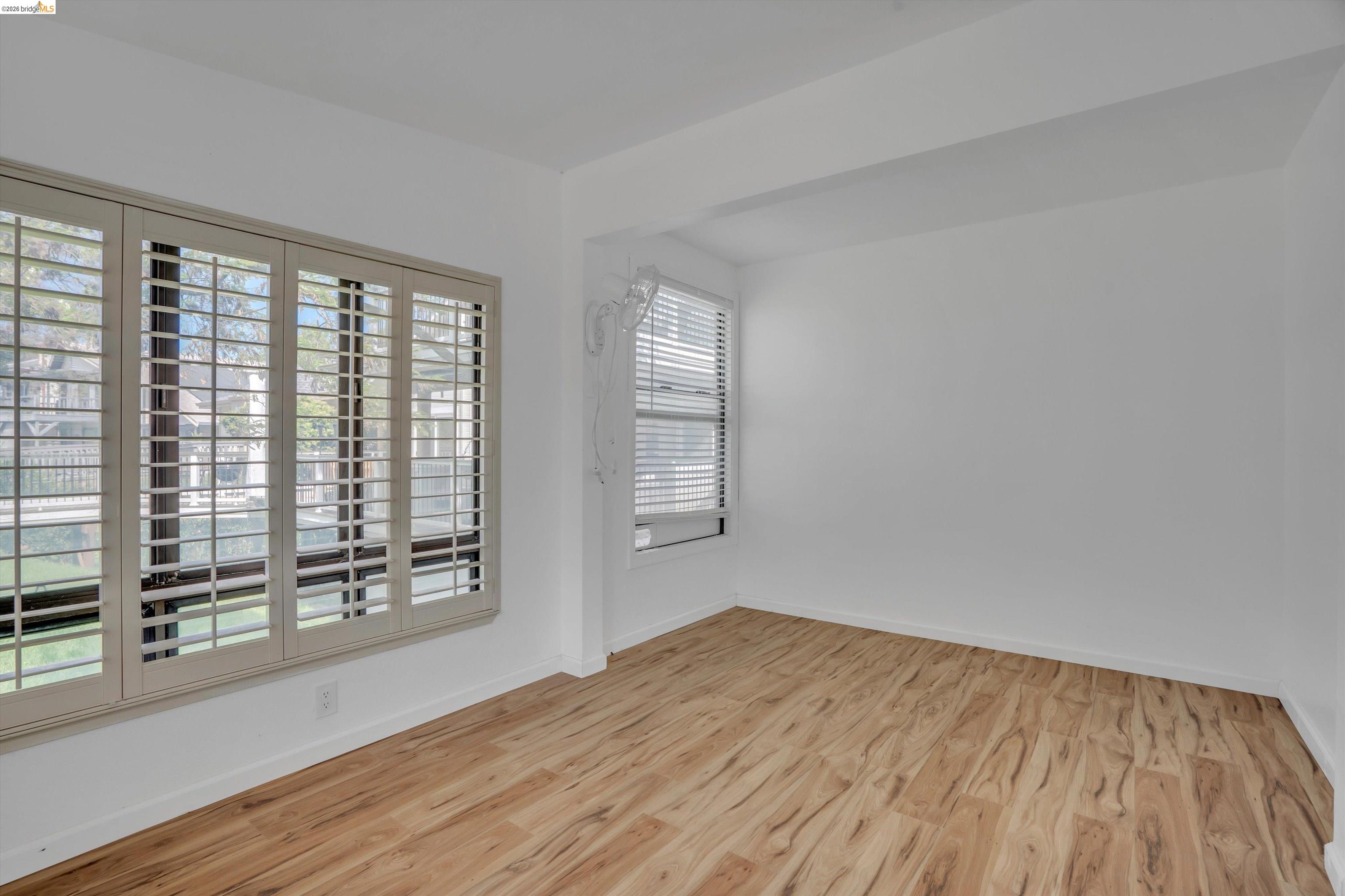 1922 Taylor Road Bethel Island, CA 94511 - Photo 16 of 49 wooden floor in an empty room with a window