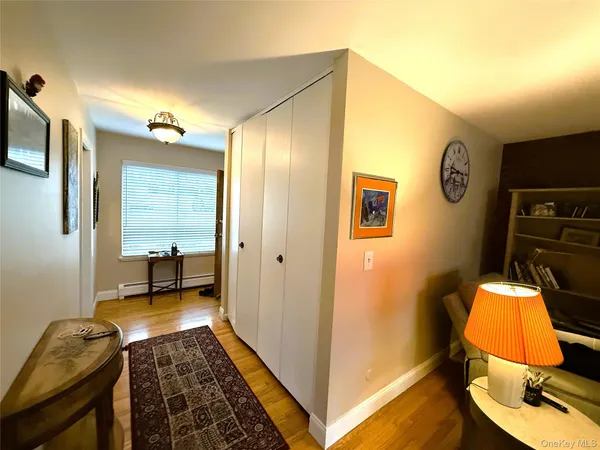 a bedroom with a bed next to a window