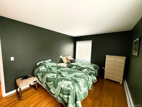 a bedroom with bed and a window