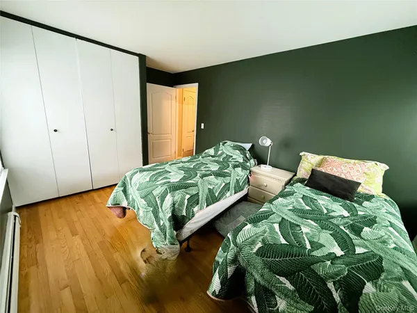 a view of a balcony with wooden floor