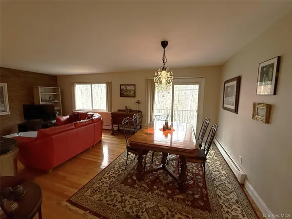 a living room with furniture a table and a window