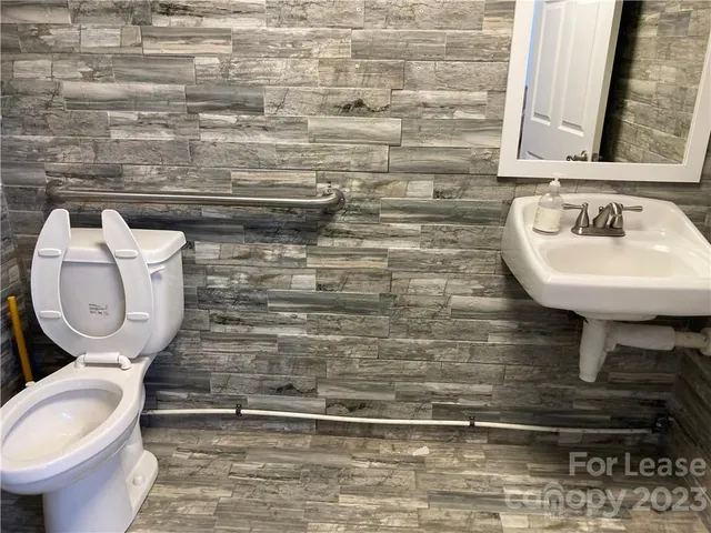 a bathroom with a toilet and a sink