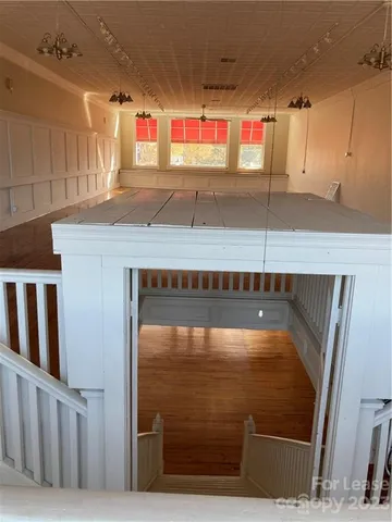 a bathroom with a sink toilet and a mirror
