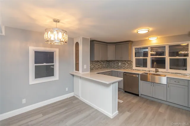 a kitchen with stainless steel appliances granite countertop a stove and a sink