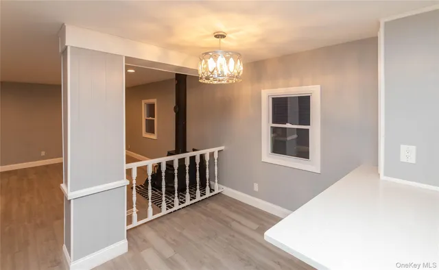 a view of livingroom with stairs and furniture