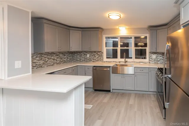 a kitchen with a sink stove and refrigerator