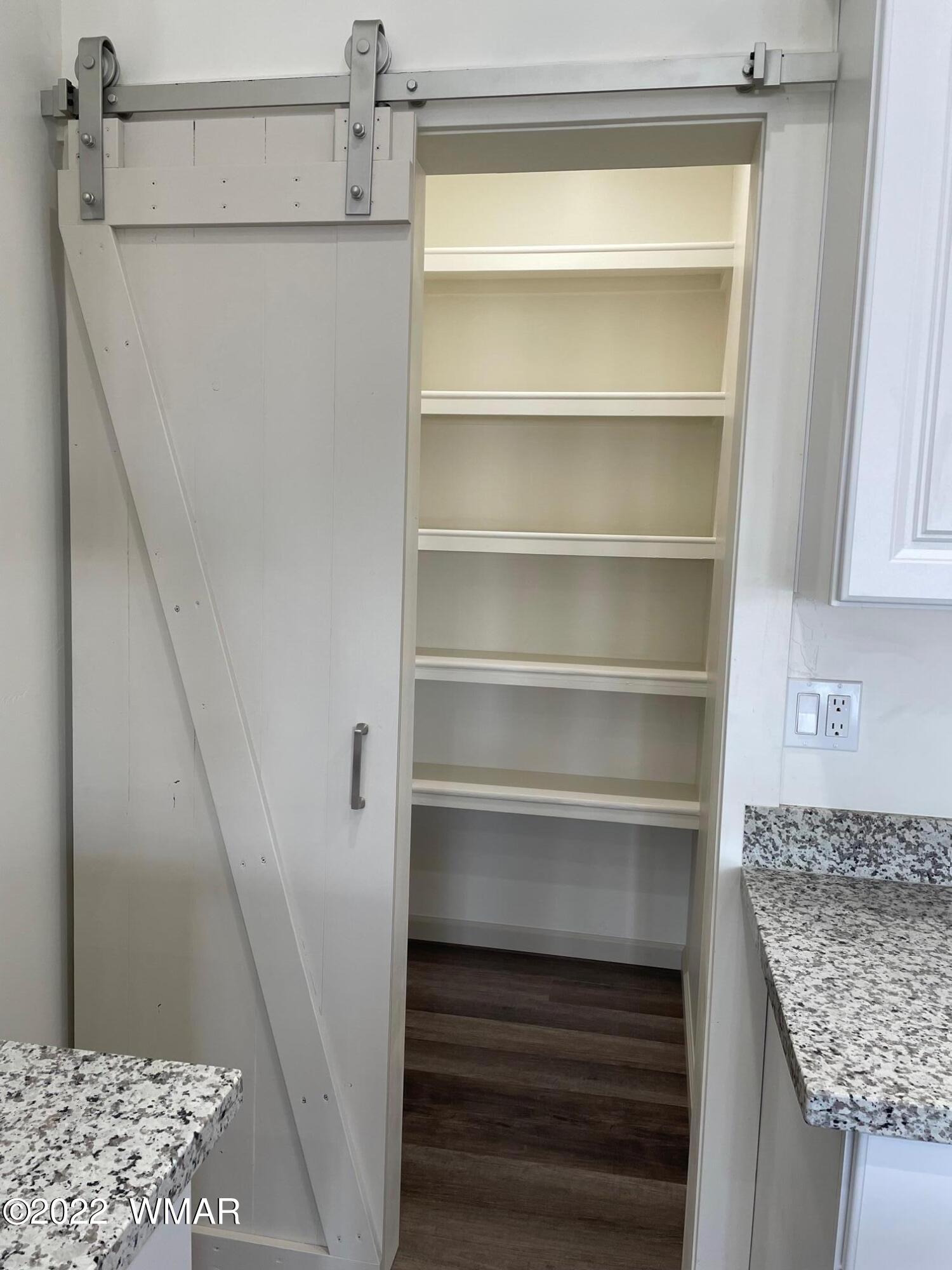 442 Susie Lane Springerville, AZ 85938 - Photo 11 of 46 a view of storage and utility room with wooden floor