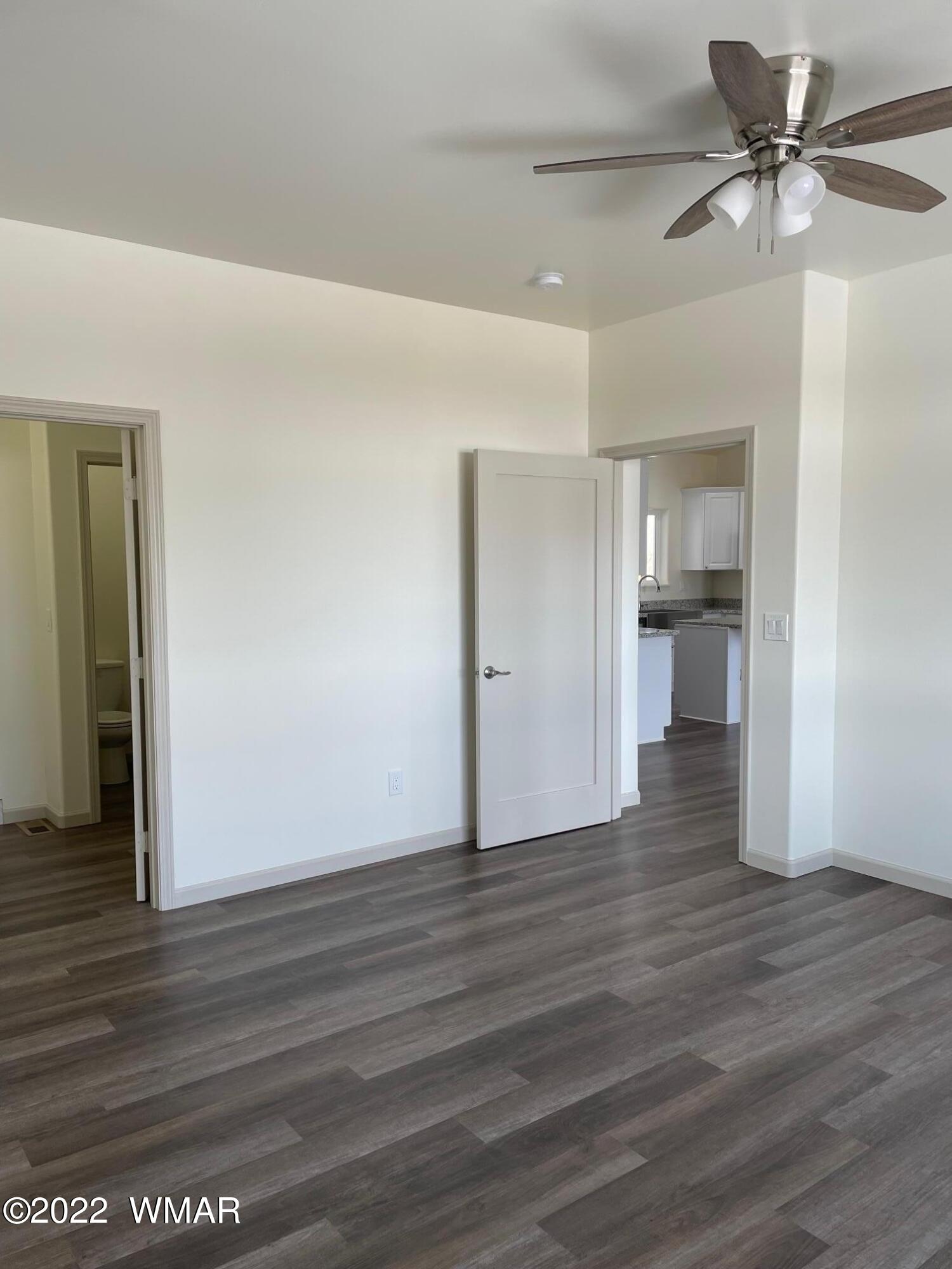 442 Susie Lane Springerville, AZ 85938 - Photo 21 of 46 a view of an empty room and wooden floor