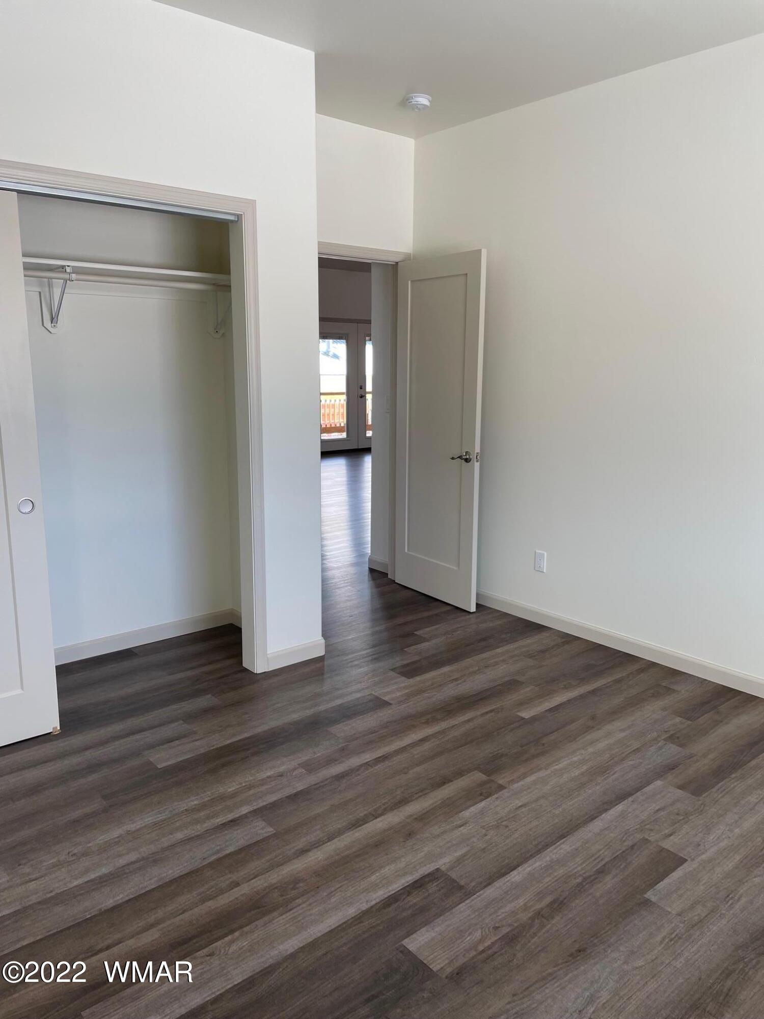 442 Susie Lane Springerville, AZ 85938 - Photo 23 of 46 a view of empty room with wooden floor