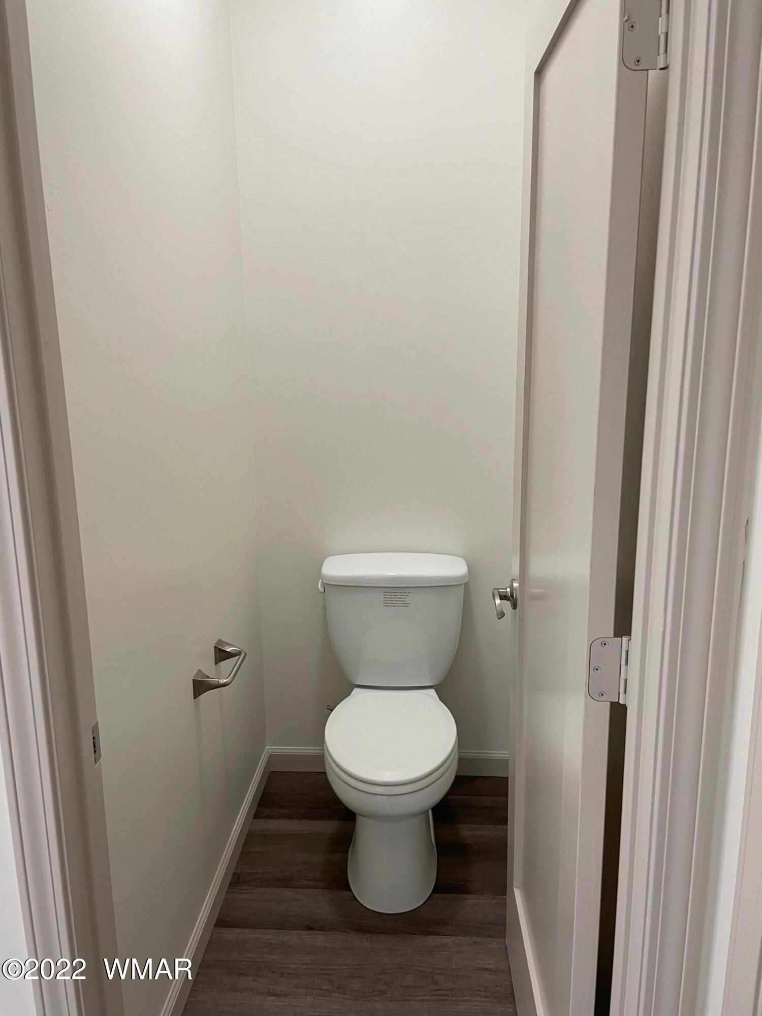 442 Susie Lane Springerville, AZ 85938 - Photo 30 of 46 a white toilet sitting in a bathroom next to a sink