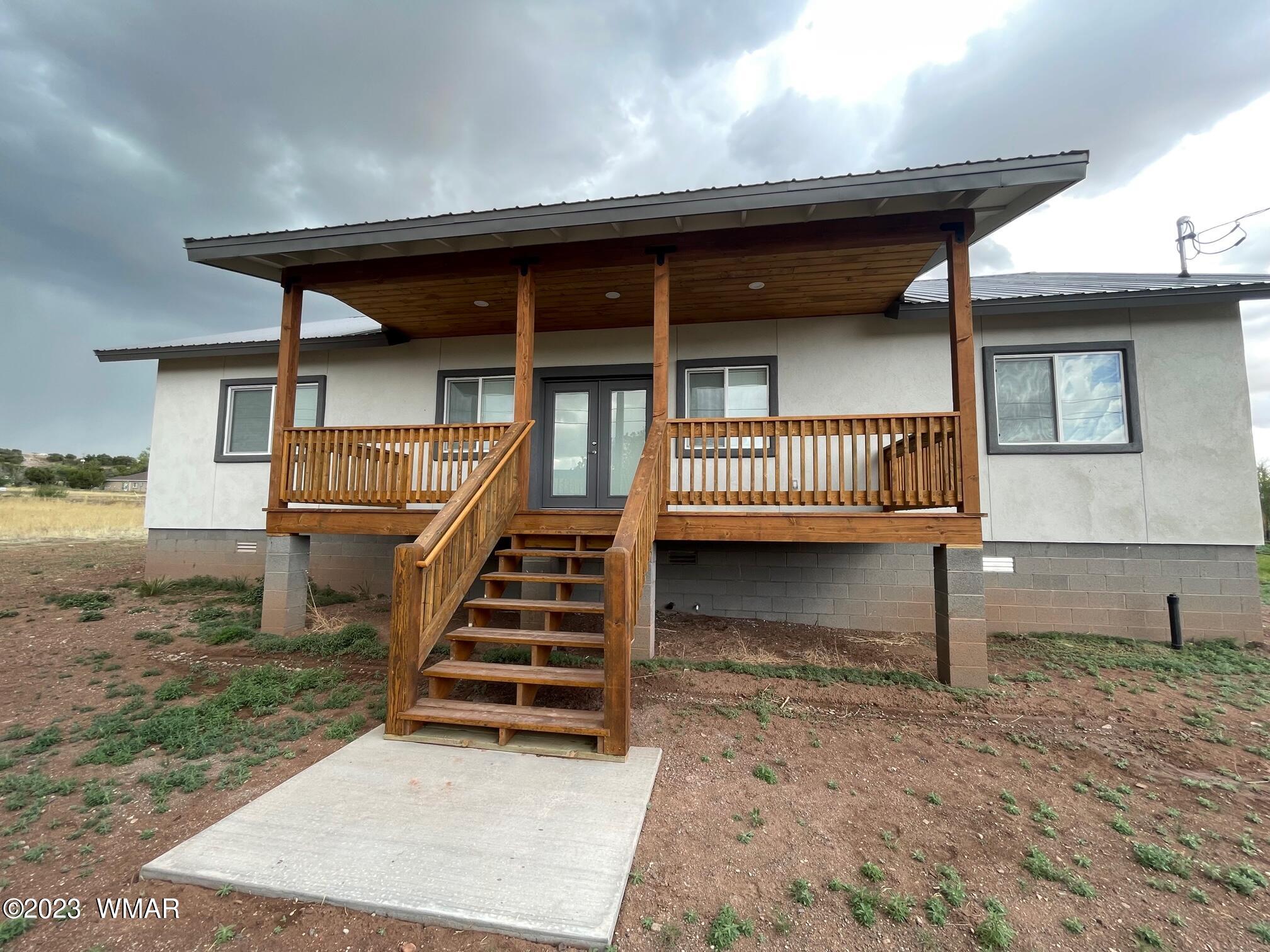 442 Susie Lane Springerville, AZ 85938 - Photo 43 of 46 a view of a house with backyard and wooden fence