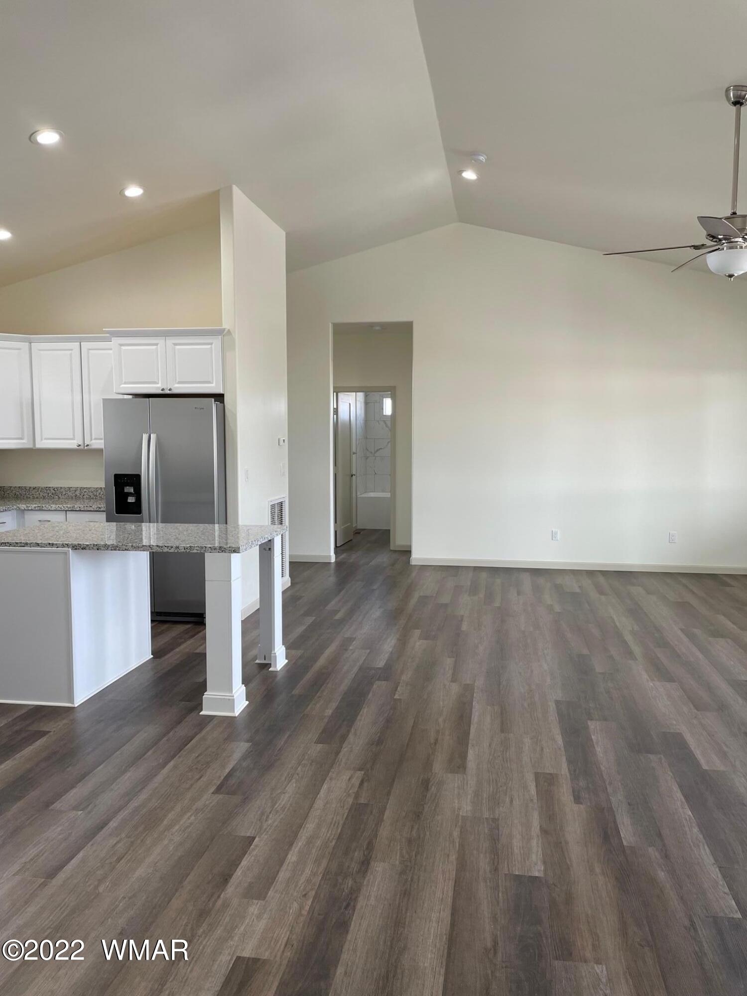 442 Susie Lane Springerville, AZ 85938 - Photo 6 of 46 a view of kitchen with wooden floor electronic appliances and window