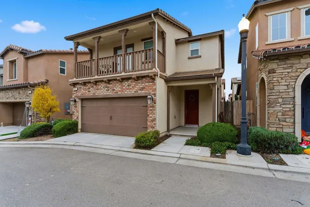 a front view of a house with yard