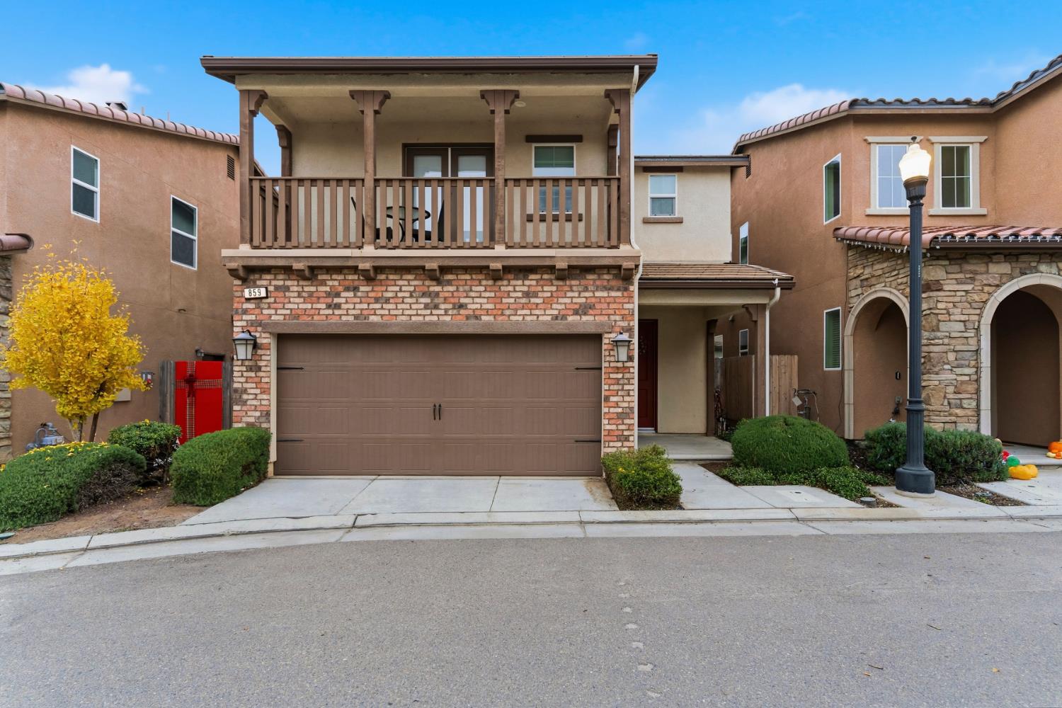 859 Lassen Lane West Madera, CA 93636 - Photo 2 of 19 a front view of a house with garage and plants