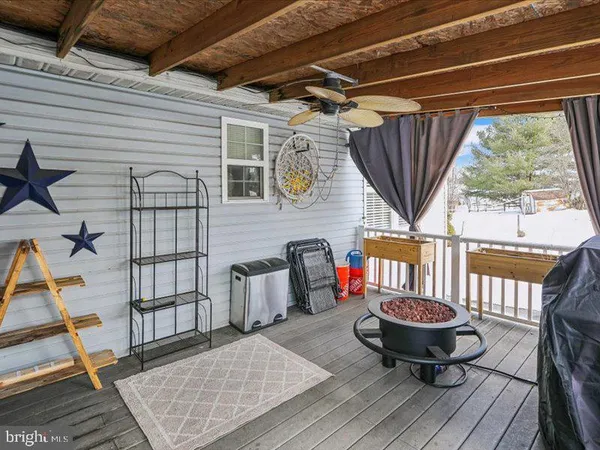 a view of a chairs and table in the balcony