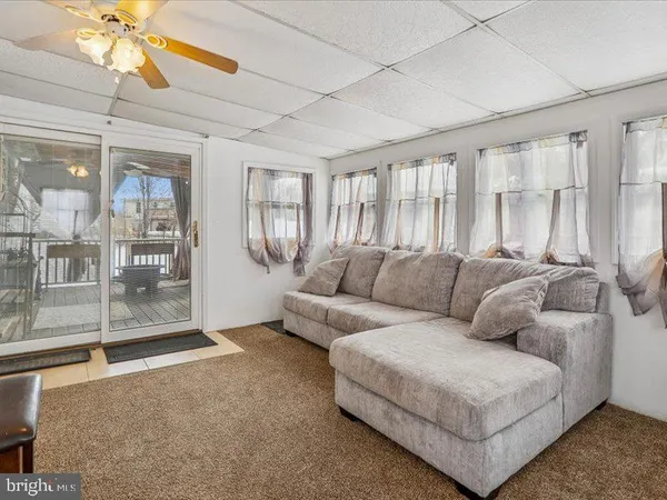 a bedroom with a bed and a table with lamp