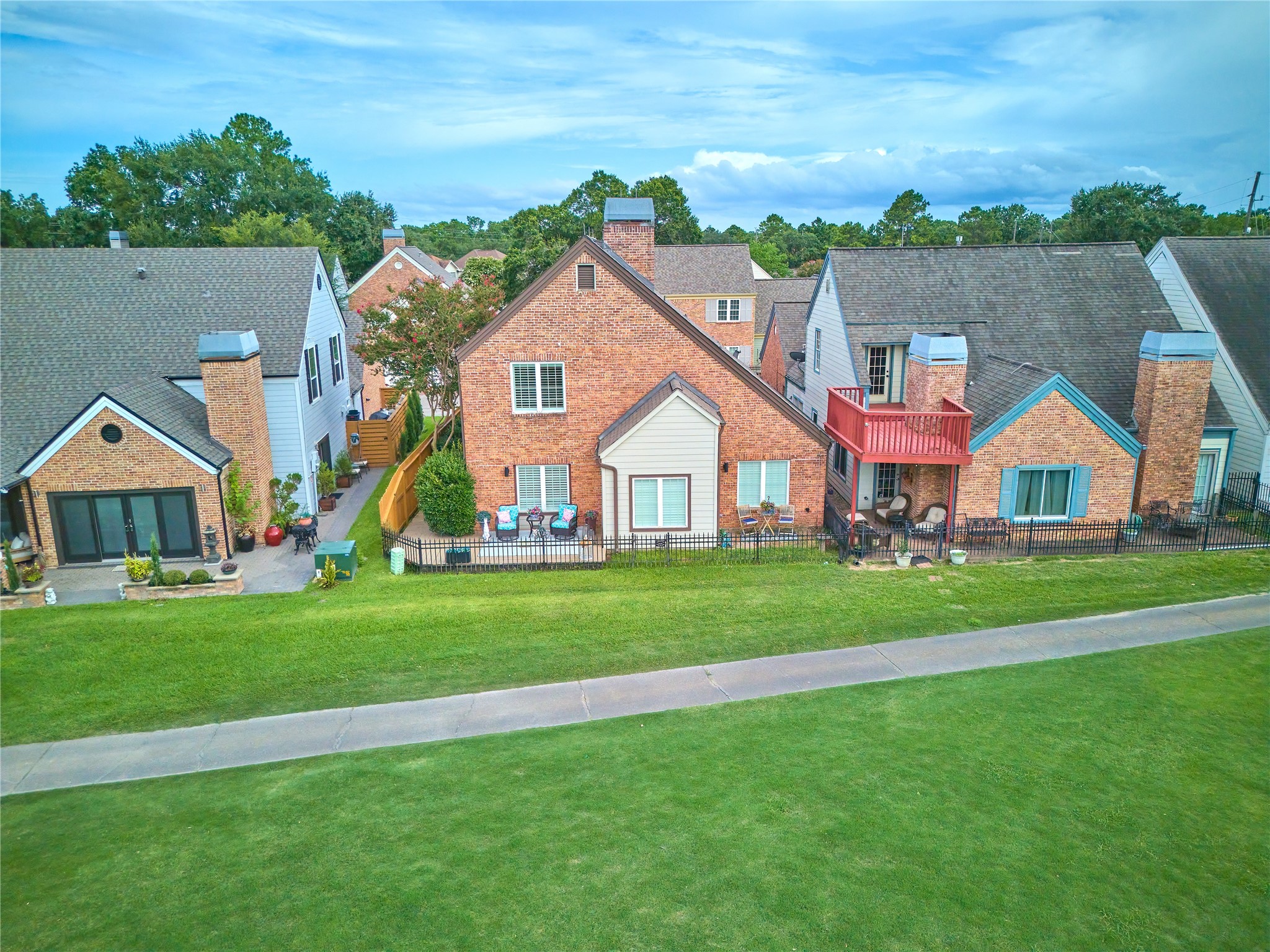 7631 Ameswood Road Houston, TX 77095 - Photo 2 of 33 a view of house with garden and tall trees