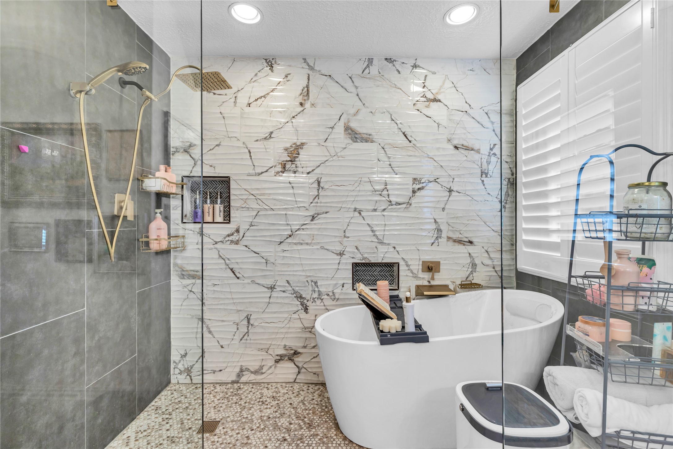 7631 Ameswood Road Houston, TX 77095 - Photo 23 of 33 a bathroom with a bathtub and shower