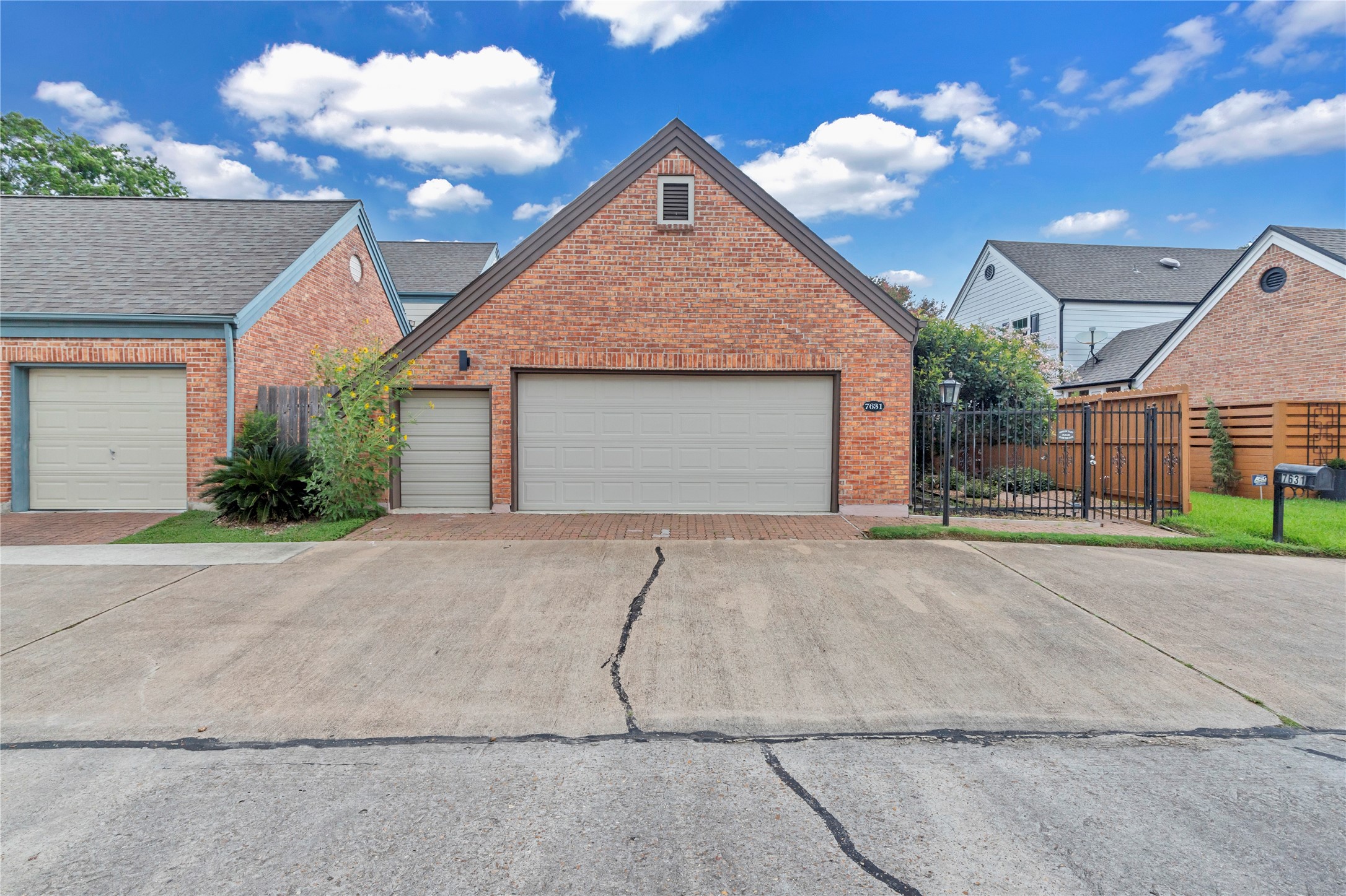 7631 Ameswood Road Houston, TX 77095 - Photo 30 of 33 a front view of a house with a yard and garage