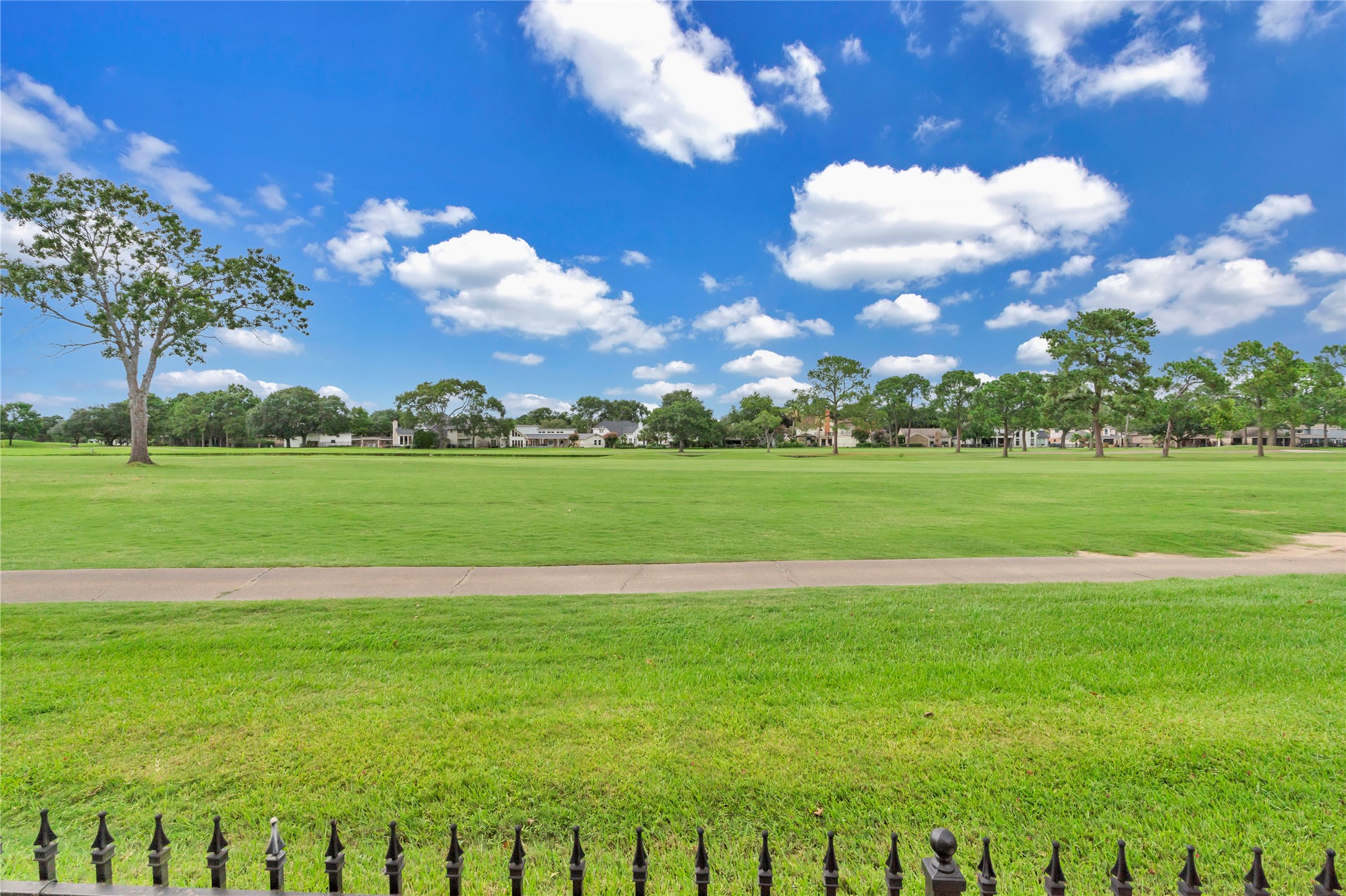 7631 Ameswood Road Houston, TX 77095 - Photo 31 of 33 a view of a golf course with a big yard