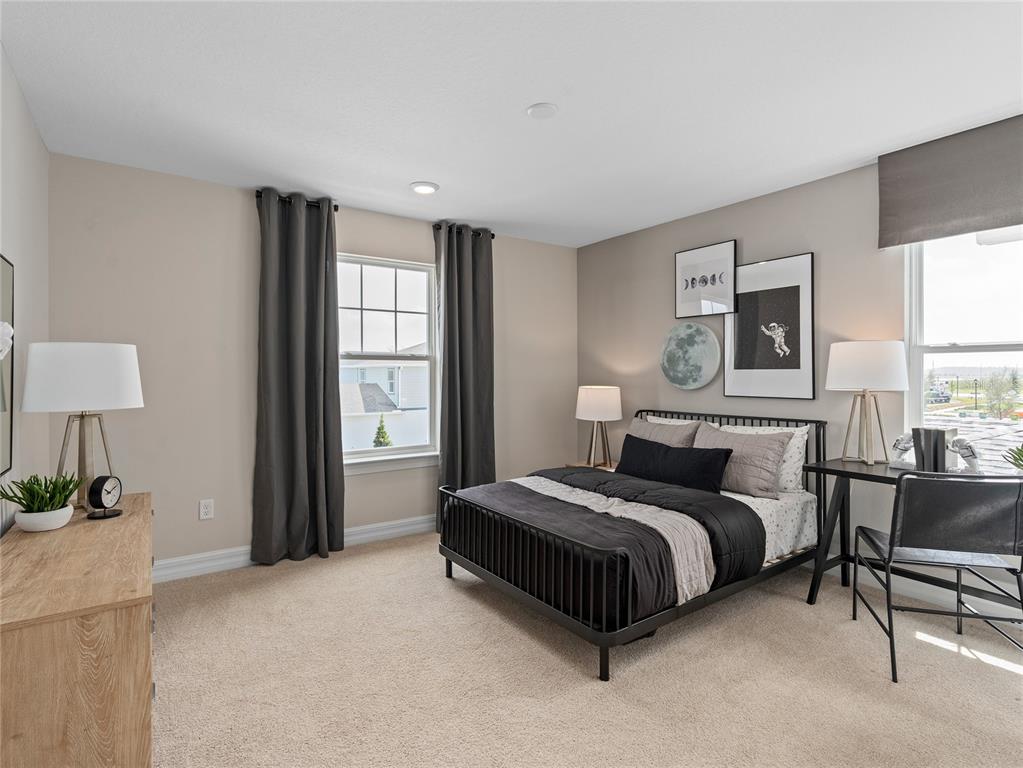 5624 Flame Vine Way St. Cloud, FL 34771 - Photo 26 of 29 a spacious bedroom with a bed and a window