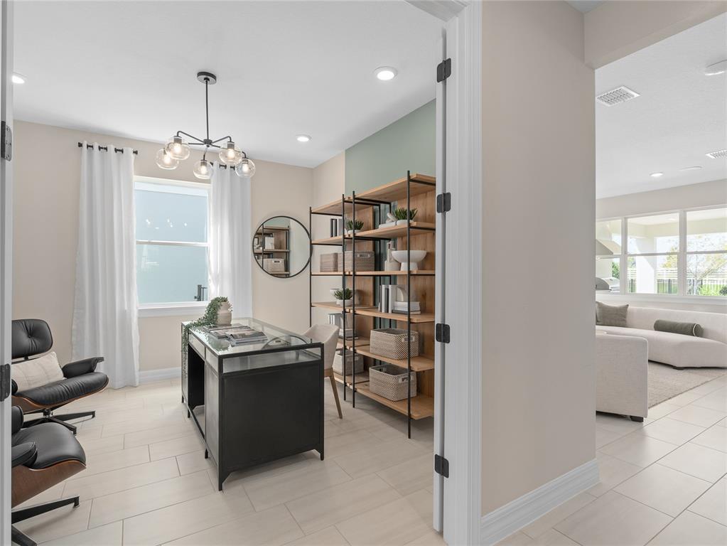 5624 Flame Vine Way St. Cloud, FL 34771 - Photo 8 of 29 a room with furniture a chandelier a mirror and a window