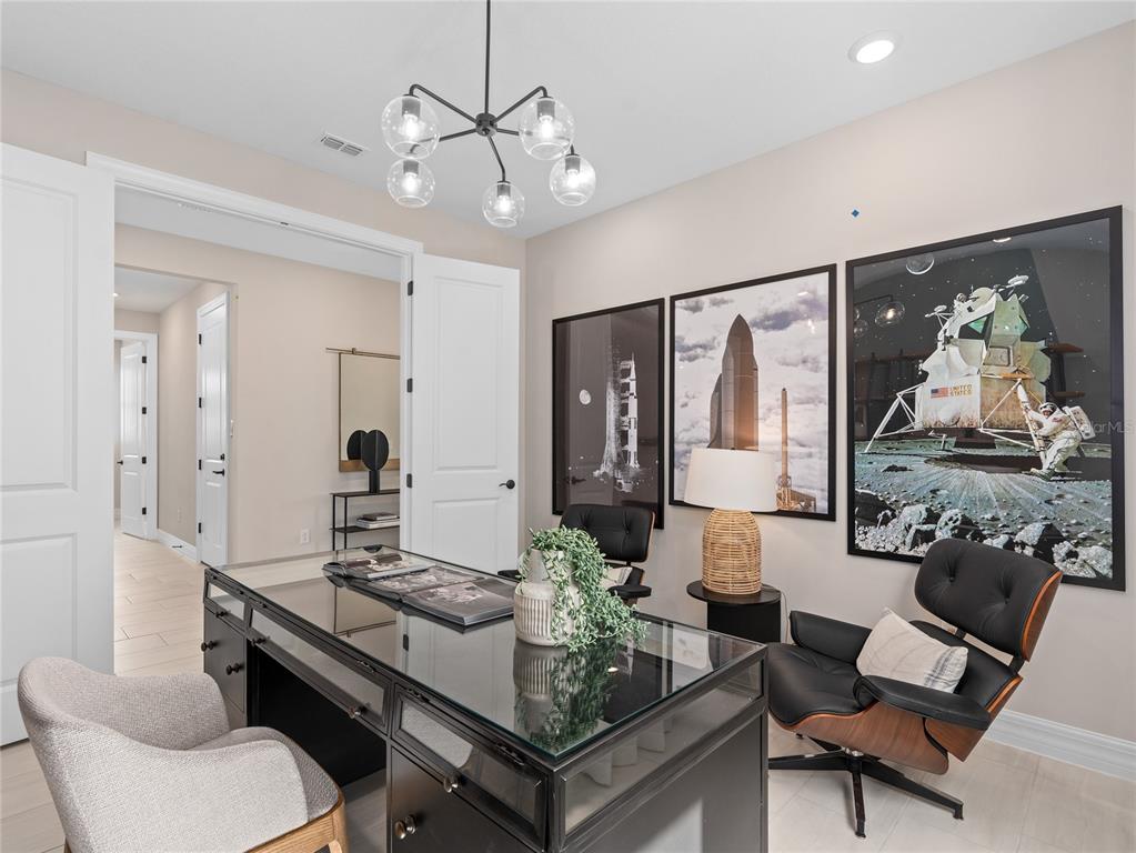 5624 Flame Vine Way St. Cloud, FL 34771 - Photo 9 of 29 a living room with furniture and a chandelier