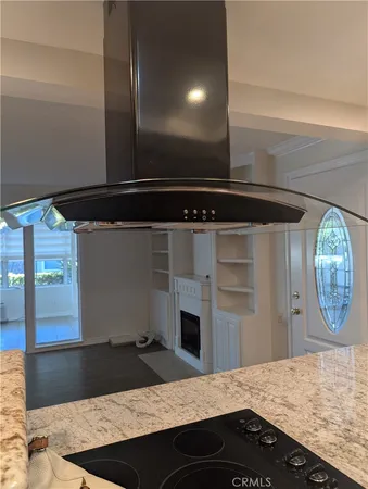 a kitchen with kitchen island a counter and a sink