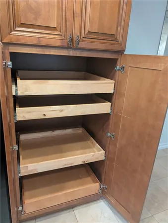 a stove top oven sitting inside of a kitchen
