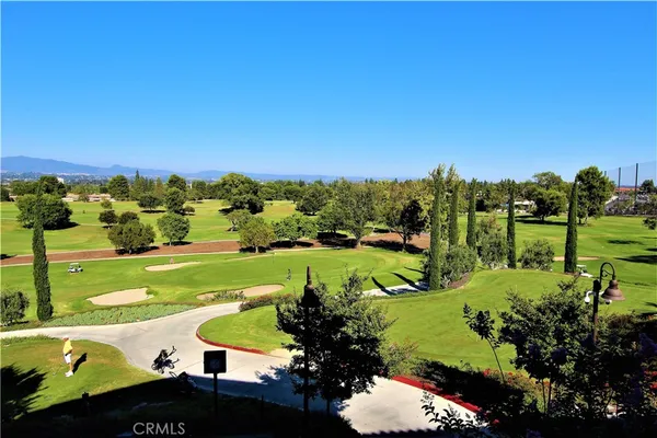 a view of a park with sitting area