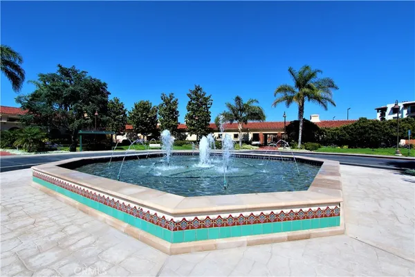a view of yard with swimming pool and trees