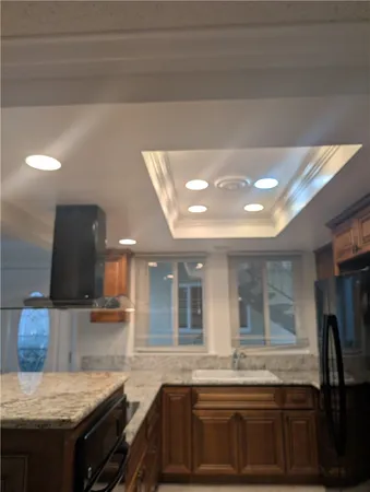 a kitchen with a stove and a sink