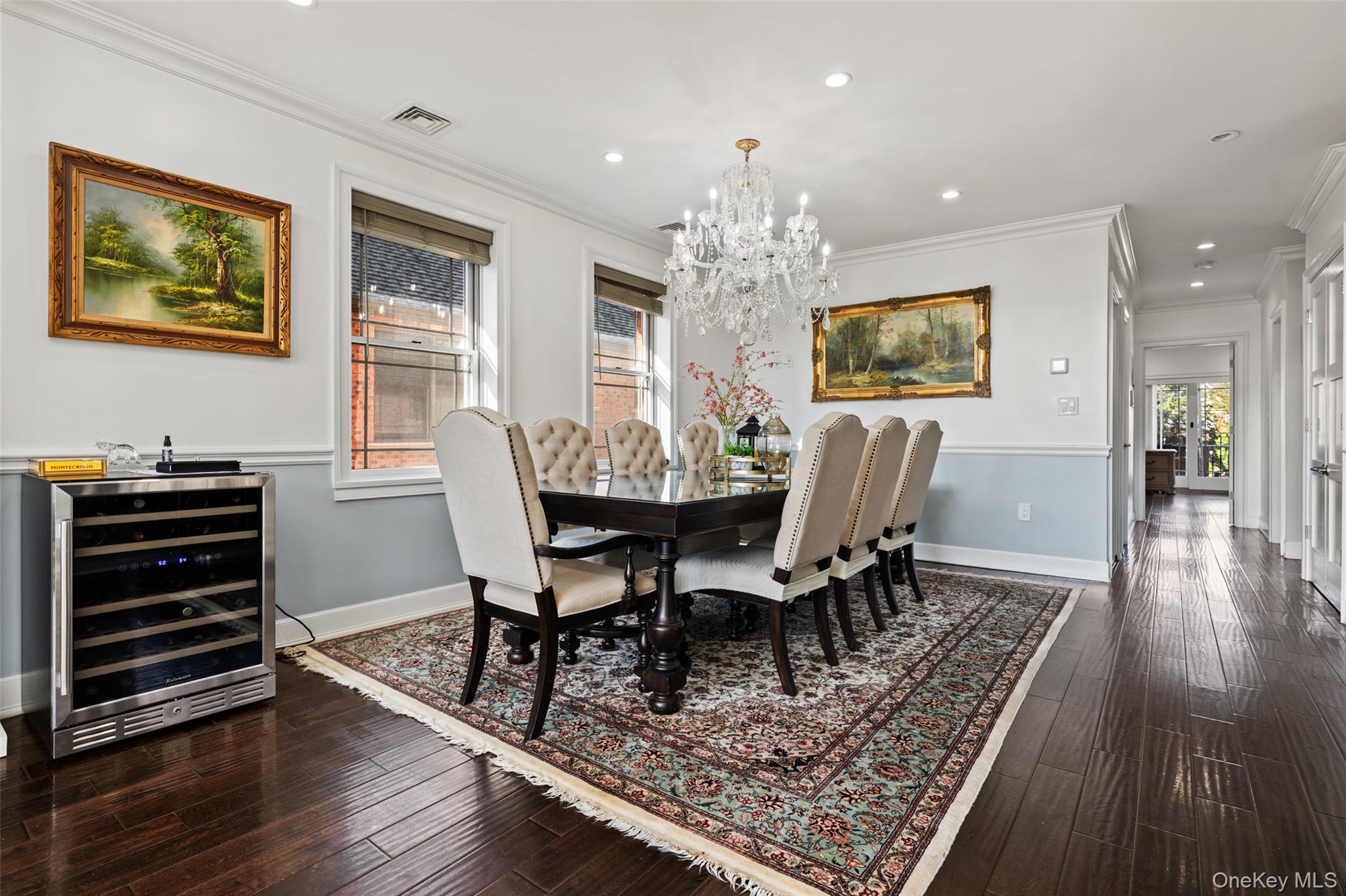 2063 Narragansett Avenue, Unit 2 Bronx, NY 10461 - Photo 12 of 37 Dining area with crown molding, beverage cooler, recessed lighting, dark wood finished floors, and a chandelier