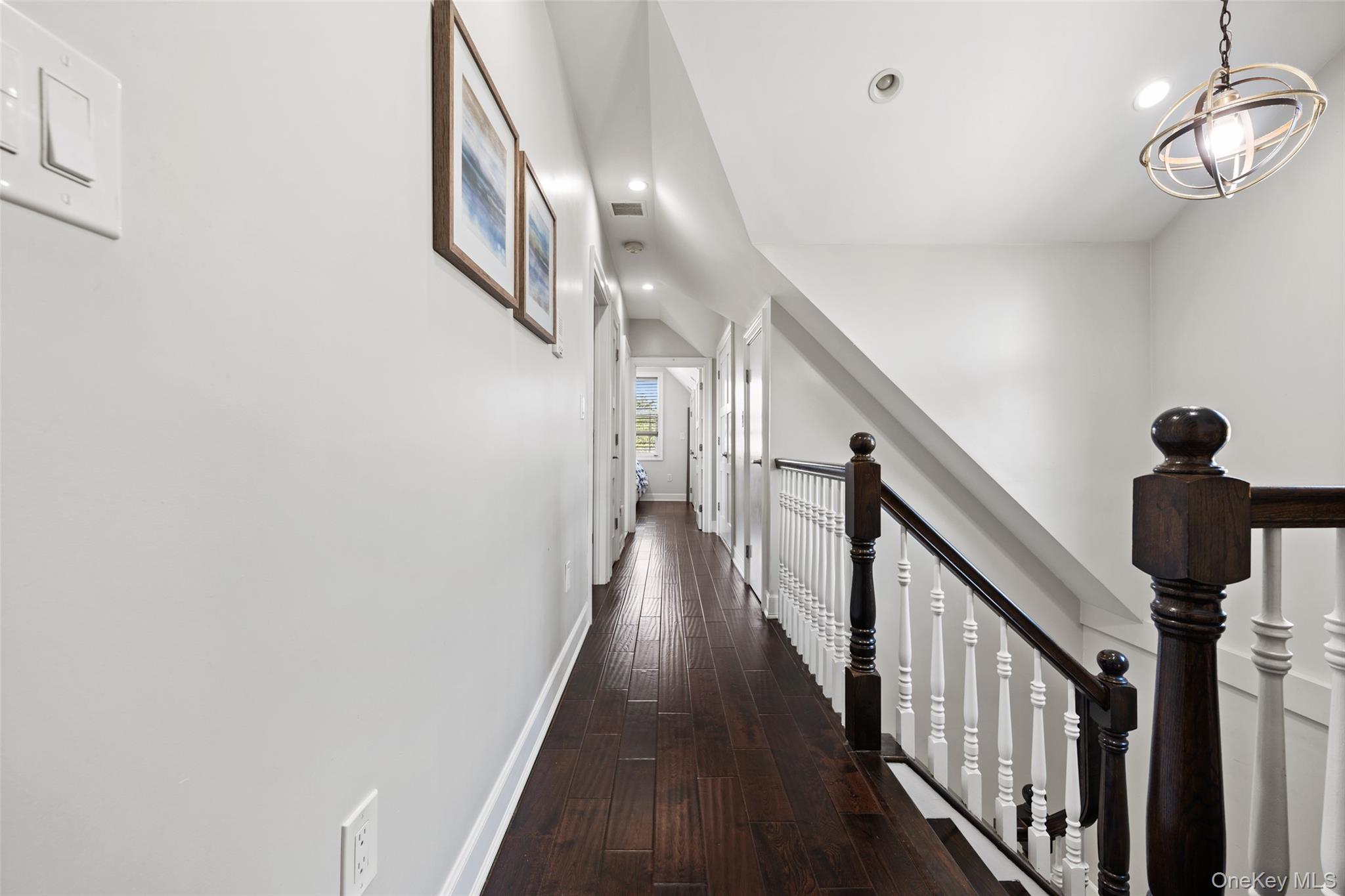 2063 Narragansett Avenue, Unit 2 Bronx, NY 10461 - Photo 19 of 37 Hallway with dark wood-style floors, recessed lighting, and an upstairs landing