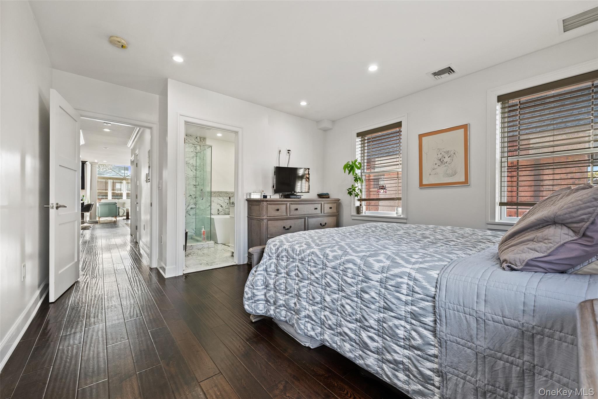 2063 Narragansett Avenue, Unit 2 Bronx, NY 10461 - Photo 20 of 37 Bedroom featuring dark wood-type flooring, recessed lighting, and connected bathroom