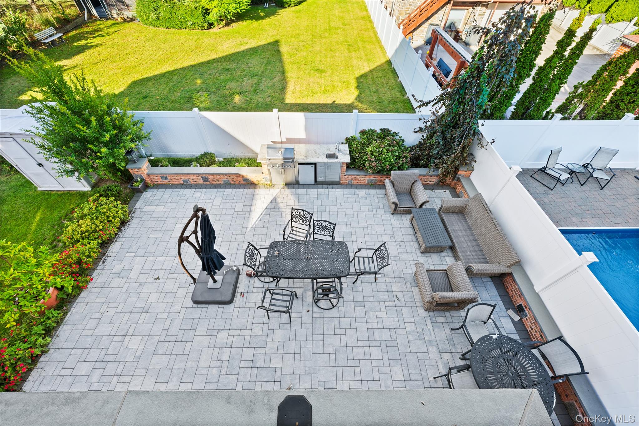 2063 Narragansett Avenue, Unit 2 Bronx, NY 10461 - Photo 23 of 37 Fenced backyard with a patio area, area for grilling, and outdoor dining area